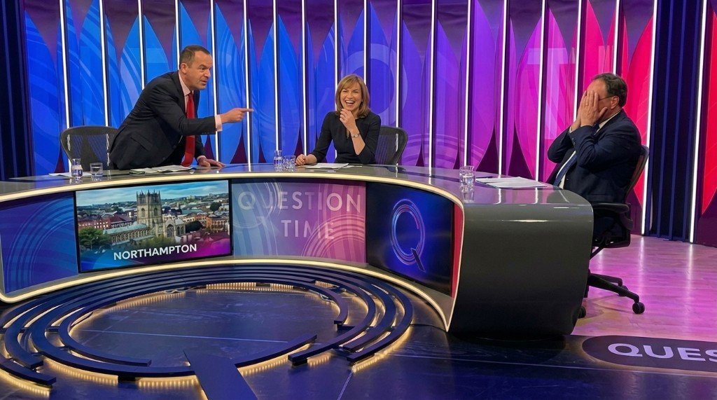 BBC Question Time panel laughing during a live broadcast in Northampton